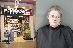 Woman places merchandise in pocket at Vero Beach Spencer's.