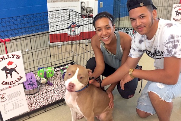 Dolly's Dream Project dog Maple poses with her new adopter, Vero Beach resident Caprice Jones-Moyer. Once known as Trixie, Maple was one of the Humane Society's first dogs who found a loving home thanks to the generous Dolly's Dream Project grant that sponsors adoption fees, training, and supplies.