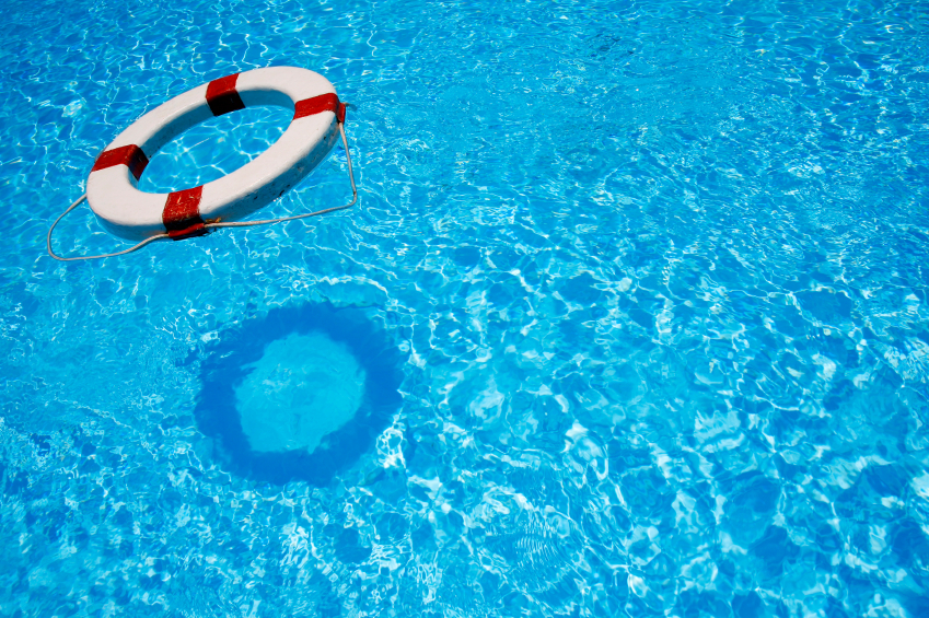 Safety lifebelt floating in bright blue water