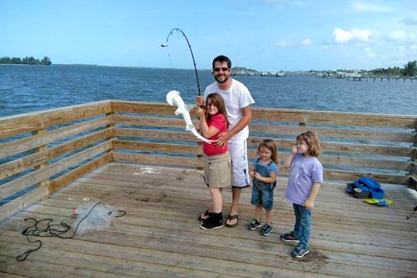 Girl catches shark off dock in Sebastian, Florida.