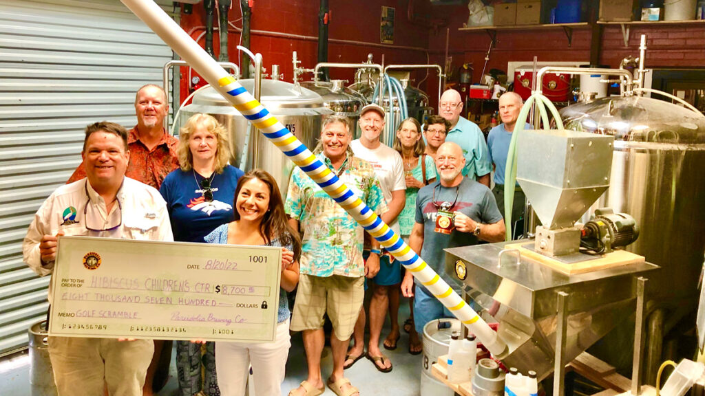 Pareidolia Brewing Company presents check to Hibiscus Children's Center