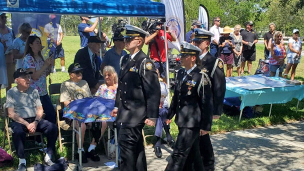 From left: Cadets Trevor Johnston, Ava Anderson, and Matthew Acosta march in review past WWII Merchant