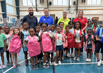 Indian River County Commissioners Susan Adams and Joe Flescher, WM, and GYAC campers and were all smiles with their new backpacks.