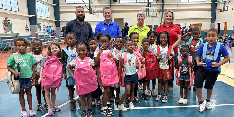 Indian River County Commissioners Susan Adams and Joe Flescher, WM, and GYAC campers and were all smiles with their new backpacks.